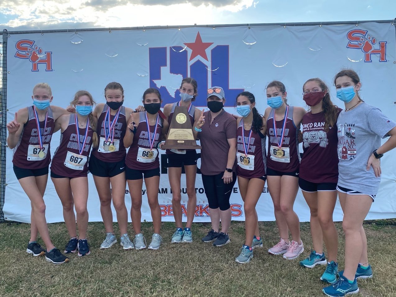 Cinco Ranch’s girls won the Region III-6A cross country team championship on Tuesday afternoon in Huntsville. Senior Sophie Atkinson, holding the team regional championship trophy, finished first.
